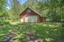 Nestled in the tranquil woods of Calumet on a dead end road for sale in Calumet Michigan Houghton County County on GolfHomes.com