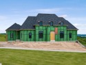 Introducing a new construction home in the prestigious for sale in Williamsburg Michigan Grand Traverse County County on GolfHomes.com
