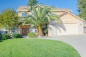 Welcome to this Northwest retreat with stunning curb appeal for sale in Visalia California Tulare County County on GolfHomes.com