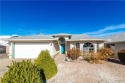 This charming 3-bedroom, 2-bathroom home offers a perfect blend for sale in Kingman Arizona Mohave County County on GolfHomes.com