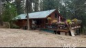 Motivated Seller! Log cabin with many improvements through the for sale in Garden Valley Idaho Boise County County on GolfHomes.com