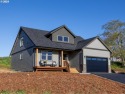 Nestled just steps from Lewis & Clark Elementary, this stunning for sale in Astoria Oregon Clatsop County County on GolfHomes.com