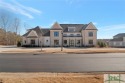 Nestled on the *Black 4* Fairway of The Georgia Club, this for sale in Statham Georgia Barrow County County on GolfHomes.com