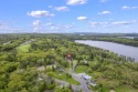 Located at the end of Belgrade Lakes Village, 14 Lakeshore Drive for sale in Belgrade Maine Kennebec County County on GolfHomes.com