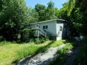 Charming 2 bedroom home in need of some TLC. Directly across for sale in Castleton Vermont Rutland County County on GolfHomes.com