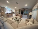 Experience the epitome of luxurious living in this exceptional for sale in Boynton Beach Florida Palm Beach County County on GolfHomes.com
