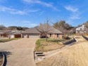 Step into this stunning 3-bedroom, 2-bath brick home perfectly for sale in De Cordova Texas Hood County County on GolfHomes.com