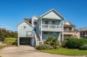 Nestled within The Village at Nags Head, this inviting property for sale in Nags Head North Carolina Dare County County on GolfHomes.com