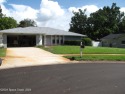 Move in ready pool home with a 2 car garage at the end of a cul for sale in Titusville Florida Brevard County County on GolfHomes.com