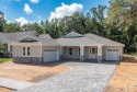 NEW BUILD with CDD fee paid off by the builder, ready in July for sale in Brooksville Florida Hernando County County on GolfHomes.com