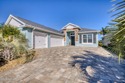 Step into a world of thoughtful beauty in this custom waterfront for sale in New Smyrna Beach Florida Volusia County County on GolfHomes.com
