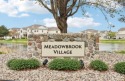 Turn-key 1BR/1BA + den end-unit condo in Pewaukee's popular for sale in Pewaukee Wisconsin Waukesha County County on GolfHomes.com