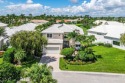 Soaring two-story ceiling heights greet you upon entering this for sale in Boca Raton Florida Palm Beach County County on GolfHomes.com