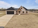 This stunning home offers captivating views of the lush golf for sale in Hawkinsville Georgia Pulaski County County on GolfHomes.com