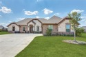 Back on the market! Welcome to this exceptional 4-bedroom for sale in Granbury Texas Hood County County on GolfHomes.com