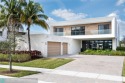A Modern Masterpiece nestled within the exclusive enclave  gated for sale in Weston Florida Broward County County on GolfHomes.com