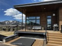Indulge in the ultimate mountain retreat with this fully for sale in Jackson Wyoming Teton County County on GolfHomes.com