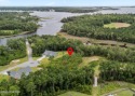 Discover the perfect blend of privacy and convenience with this for sale in Peletier North Carolina Carteret County County on GolfHomes.com