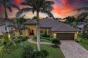 WATERFRONT LUXURY AWAITS at this gorgeous 2013 built custom POOL for sale in Punta Gorda Florida Charlotte County County on GolfHomes.com