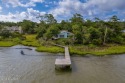 Nestled in a private setting at the end of a cul-de-sac, this for sale in Pine Knoll Shores North Carolina Carteret County County on GolfHomes.com