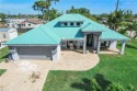 This sounds like a dream home! The high ceiling and metal roof for sale in Fort Myers Florida Lee County County on GolfHomes.com