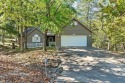 Beautifully maintained three-bedroom, two-bath home situated on for sale in Holiday Island Arkansas Carroll County County on GolfHomes.com