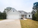 This home features beautiful woods floors throughout the home for sale in Bella Vista Arkansas Benton County County on GolfHomes.com