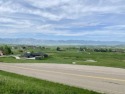 SWEEPING VIEWS of the Big Horn Mountains and The Powder Horn for sale in Sheridan Wyoming Sheridan County County on GolfHomes.com