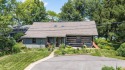 Beautiful lakefront log home located at Crooked Lake. This 4 for sale in Columbia City Indiana Whitley County County on GolfHomes.com
