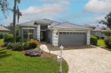 Beautiful waterfront pool home on a cul-de-sac with a NEW ROOF for sale in Port Charlotte Florida Charlotte County County on GolfHomes.com