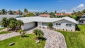 Coastal luxury meets resort-style living in this updated 3,000 for sale in New Port Richey Florida Pasco County County on GolfHomes.com