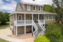 Imagine waking up to the serene views of a meticulously for sale in Kitty Hawk North Carolina Dare County County on GolfHomes.com