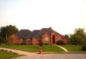 Custom built, all brick ranch backing to Locust Hills Golf for sale in Lebanon Illinois St. Clair County County on GolfHomes.com