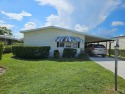 OPEN GOLF COURSE VIEW of the pond, and you own the land. This 1 for sale in Hobe Sound Florida Martin County County on GolfHomes.com