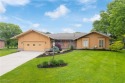 Welcome to 3752 Muirfield Dr, offering a view of the 15th green for sale in Uniontown Ohio Summit County County on GolfHomes.com