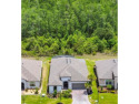 Exceptional BASTA model, BETTER THAN NEW,  built in 2022 on an for sale in Poinciana Florida Polk County County on GolfHomes.com