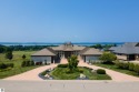 This superb home is an oasis of luxury and tranquility with for sale in Williamsburg Michigan Grand Traverse County County on GolfHomes.com