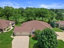 Enjoy gorgeous views in this impressive condo on the 13th hole for sale in Mount Pleasant Wisconsin Racine County County on GolfHomes.com