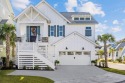 Welcome to this exquisite, nearly-new Craftsman-style beach for sale in Myrtle Beach South Carolina Horry County County on GolfHomes.com