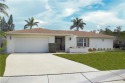 Panoramic view of Lely Hibiscus golf course from this family for sale in Naples Florida Collier County County on GolfHomes.com