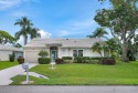 This charming home is perfectly situated on an oversized golf for sale in Jupiter Florida Martin County County on GolfHomes.com