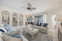 Nestled amidst mature landscaping, this home offers serene views for sale in Bonita Springs Florida Lee County County on GolfHomes.com