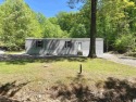 Are you in search of a budget-friendly lake retreat? If yes for sale in Cadiz Kentucky Trigg County County on GolfHomes.com