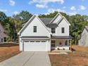 Welcome home to this spacious 4-bedroom, 2.5-bath residence for sale in Youngsville North Carolina Franklin County County on GolfHomes.com