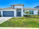 A true custom build ABD home looking across the 15th fairway at for sale in Davenport Florida Polk County County on GolfHomes.com