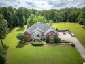 Discover luxury living in this beautiful over 4,000 sf brick and for sale in Benton Kentucky Marshall County County on GolfHomes.com