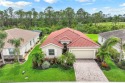 IMMACULATE 1-owner home with private PRESERVE VIEW and a for sale in Cape Coral Florida Lee County County on GolfHomes.com