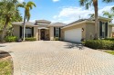 This custom-built home in surrounded by mature landscaping in for sale in Englewood Florida Sarasota County County on GolfHomes.com