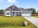 Motivated sellers! Discover this beautifully crafted 4-bedroom for sale in Peletier North Carolina Carteret County County on GolfHomes.com
