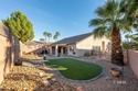 Private backyard with turf and a covered patio in the desirable for sale in Mesquite Nevada Clark County County on GolfHomes.com